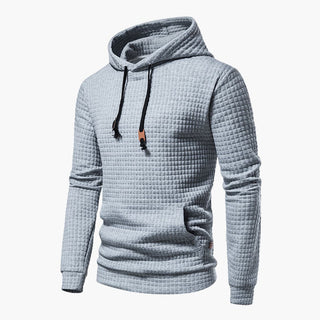 Kornyx grauer Hoodie mit gesteppter Textur und schwarzen Kordeln. Modernes, gemütliches Design für vielseitige Freizeitlooks.