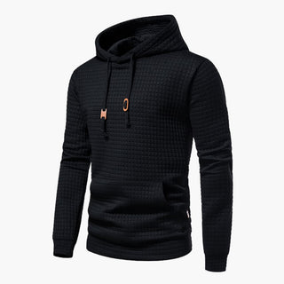 Kornyx Hoodie in Schwarz mit quadratischer Struktur, Kordelzug und Kängurutasche. Moderner und bequemer Kapuzenpullover für Freizeit und Sport.