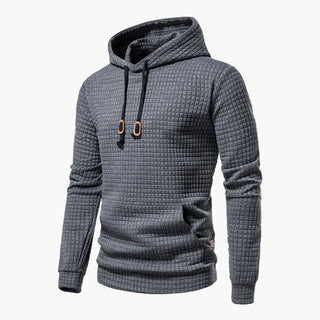 Kornyx Hoodie in Grau mit quadratischer Struktur, Kordelzug und Kängurutasche. Stilvoller und bequemer Kapuzenpullover für Freizeit und Sport.